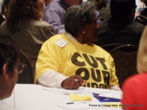 Charlotte Morrison sports a Please Cut our Budgets shirt at the Kansas Medicaid Reform Forum