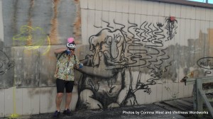 SAM_3471 Rod McBride taking a picture of me taking a picture of him at the Ruiz Pennway Graffiti Gallery. My husband and the biggest fan of the Disease Model vs. the Distress Model approach.