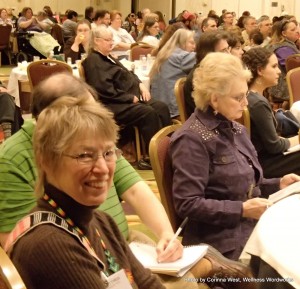 My mom, Gwen Broz, with Dr. Jean Campbell in the background at Alternatives 2012. She spoke on using spiritual traditions in modern culture.