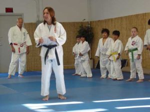 AnnMaria DeMars teaching a kids Judo clinic