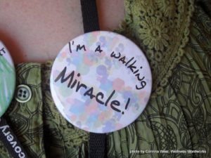I'm a walking miracle, a button given away at the Kansas certified peer specialist training.