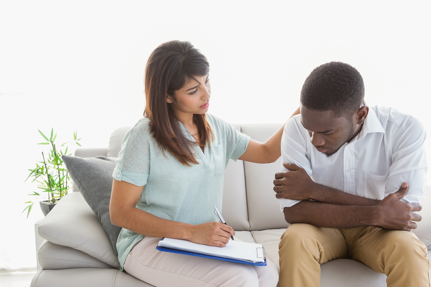 Therapist reassuring her upset patient at therapy session