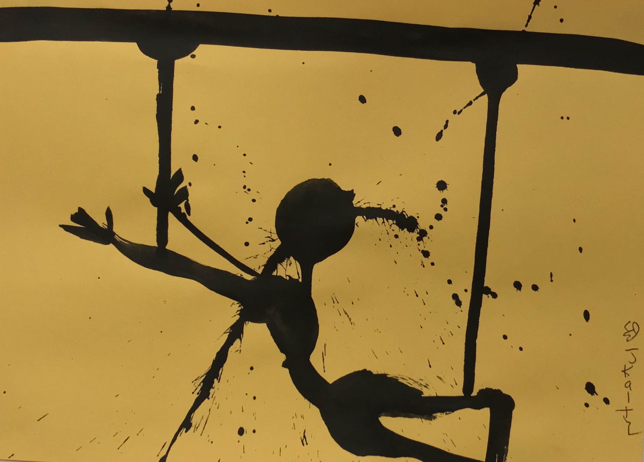 A black figure made of black splattered paint on a yellow background
