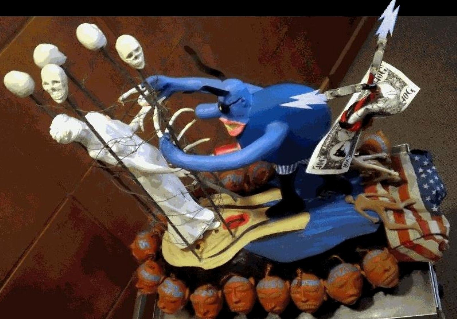 Blue figure pushing Statue of Liberty, surrounded by skulls