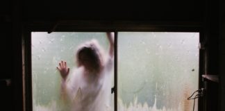 7 Tasks for a Parent Whose Child Is Diagnosed with a Mental Illness young girl at a window on rainy day