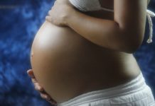 Study: Antidepressants Linked to Higher Gestational Diabetes Risk the exposed belly of a pregnant woman