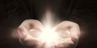 Overcoming the Madness in Us All heart hands hold light love