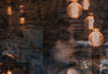 “Ontological Insecurity” May Play A Role in Psychotic Experiences Woman reflected and visible behind glass