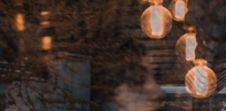 “Ontological Insecurity” May Play A Role in Psychotic Experiences Woman reflected and visible behind glass