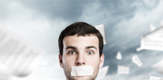 Our Movement Has a Cover-up Problem Too businessman with tape on mouth