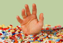 The Review on Antidepressant Withdrawal That Cochrane Won’t Publish hand reaching out from pile of pills