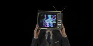 The Perils of Direct-to-Consumer Advertising man wearing suit with tv for head