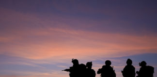 The Persistent, Misdirected Search for Causes of Trauma-based Suffering silhouette of soldiers