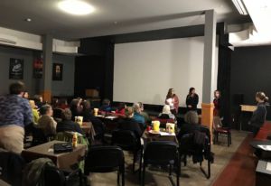 group of people sitting in amateur movie theatre