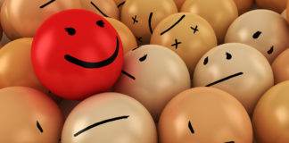 There’s Something Spreading Faster Than COVID-19, and It’s Not Fear. It’s Toxic Positivity creepy happy ball in ball pit