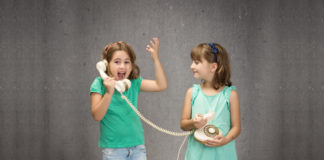 Three Recent Genetics Books and Twin Studies’ Indefensible “Equal Environment Assumption” twins using a phone
