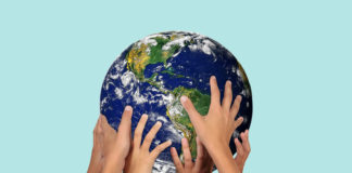 “We Are All Mad!” A Call for the Development of an International Network Among MAD Affiliates hands holding a globe
