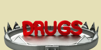 the word "drugs" in a bear trap