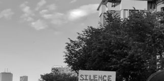 Black Suicidality and Mental Health #BlackLivesMatter protesters with a sign reading "silence is suicide"