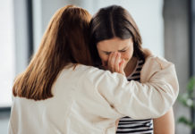 Can We Allow Suffering? two sad women embracing