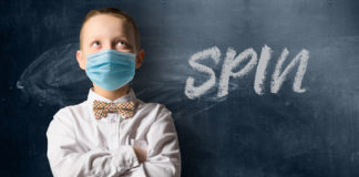 CAUTION: Spin Ahead! There is No Evidence That Psychostimulants Reduce the Risk for Infection with COVID-19 child with protective mask standing in front of blackboard and the word "spin"