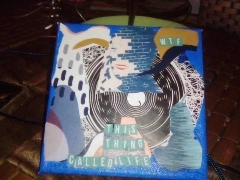 Geometric drawing of a record and the words "this thing called life"