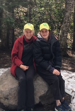 Marcia Meyers with her daughter, Lisa, wearing the yellow caps from the first symposium