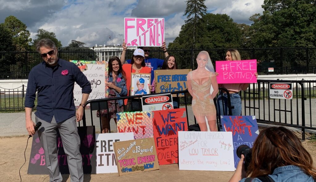 Photograph of Free Britney rallygoers holding signs in front of the White House in DC
