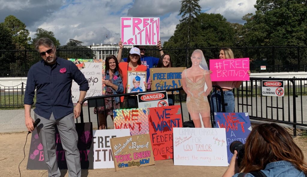 Photograph of Free Britney rallygoers holding signs in front of the White House in DC