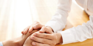 Peer Respite: Why It Should be Everyone’s Concern Close up photo of hands being held