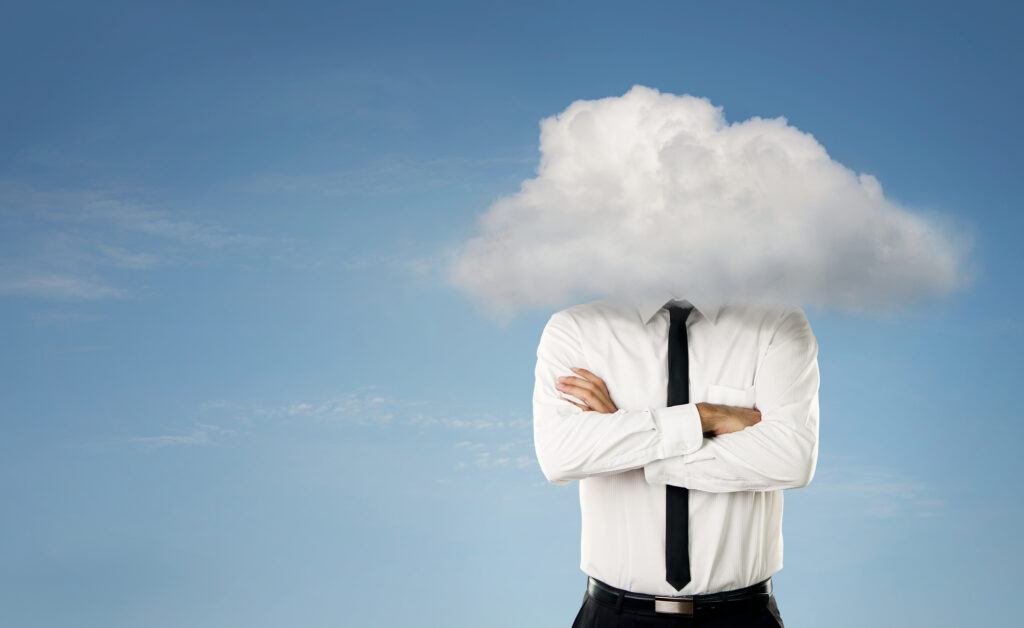 Photoshopped image of a businessman with his head covered by a cloud