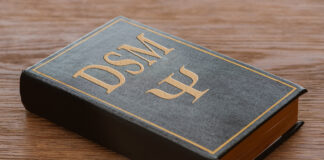 The DSM Files: Investigating the Incoherence of Psychiatry’s Bible A Bible-like book with "DSM" embossed on the cover