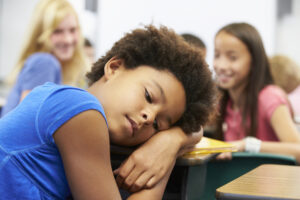 young, sad Black girl being bullied at school