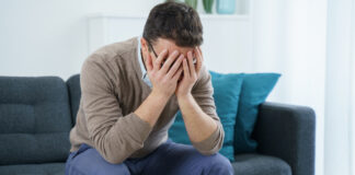 What Helps Long-Term Users of Benzodiazepines and Z-Drugs Discontinue? Picture of distressed man facing pills