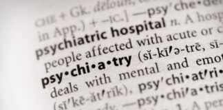 Why Is Psychiatry So Defensive About Criticism? Photo: selective focus on the word "psychiatry" in a dictionary