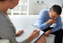 Major Review Finds Limited Effectiveness for Medication and Therapy Female psychologist consulting pensive man during psychological therapy session