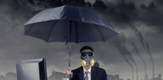 Businessman working in situation of air pollution