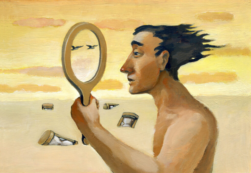 A man looking through an empty mirror and sees the landscape around him