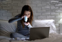 Official Guidelines on Antidepressant Discontinuation Fail Practitioners and Patients Girl, looking confused, holding pill bottle