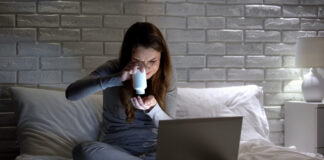 Official Guidelines on Antidepressant Discontinuation Fail Practitioners and Patients Girl, looking confused, holding pill bottle