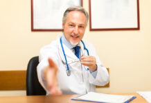 How Providers Can Support Psychiatric Drug Discontinuation Doctor welcoming a patient