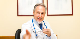 How Providers Can Support Psychiatric Drug Discontinuation Doctor welcoming a patient