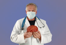 Desperate Remedies A doctor holds a brain