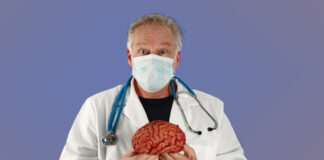 Desperate Remedies A doctor holds a brain