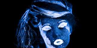 Mad by Design: An Ancient Paradigm of Psychiatric Thought Photo of a face painted, glowing in ultraviolet light