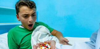 ADHD: The Money Trail A child looks shocked to receive an overflowing handful of pills