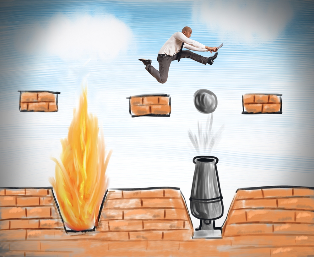 A businessman runs to overcome difficult obstacles