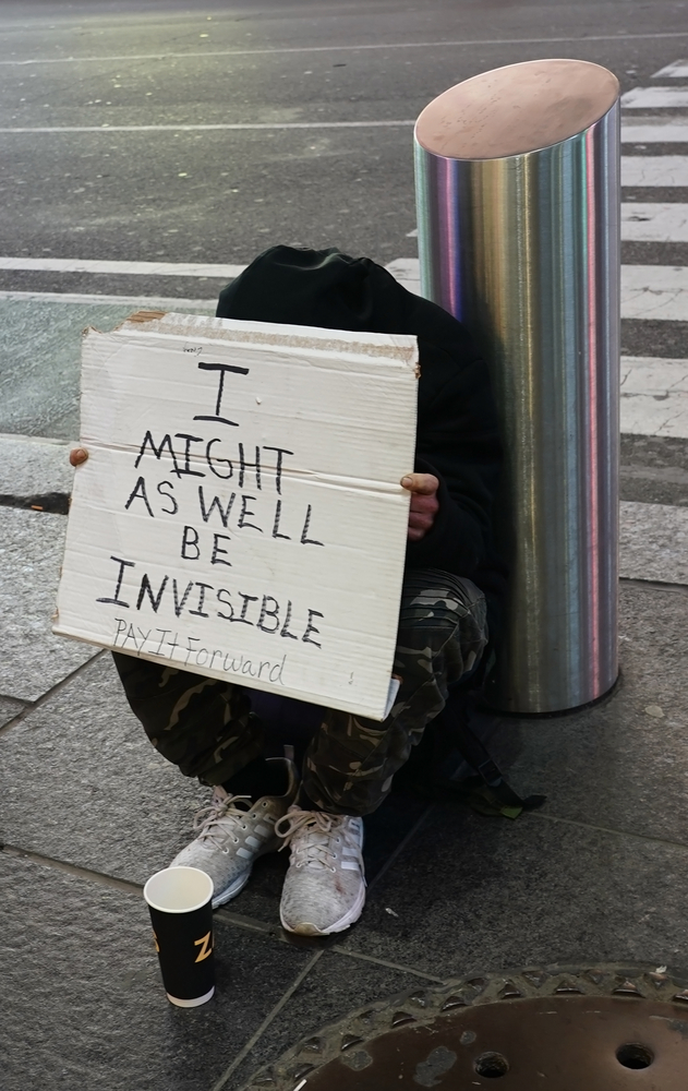 Homeless man ask for donation in midtown Manhattan. 