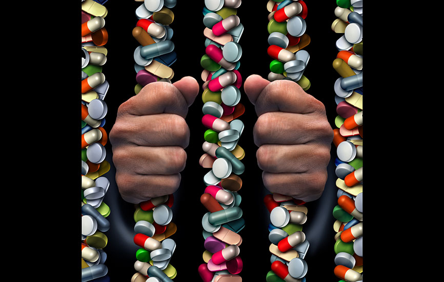 Illustration of prison bars made of prescription drugs with hands holding them