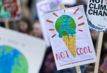 Moving From Eco-Anxiety to Eco-Anger Can Help Us Confront Climate Change People with banners protest as part of a climate change march